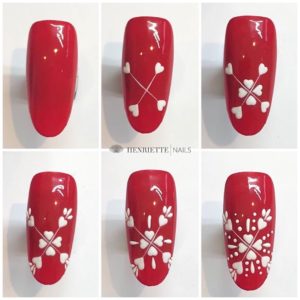 Снежинки на красных ногтях фото